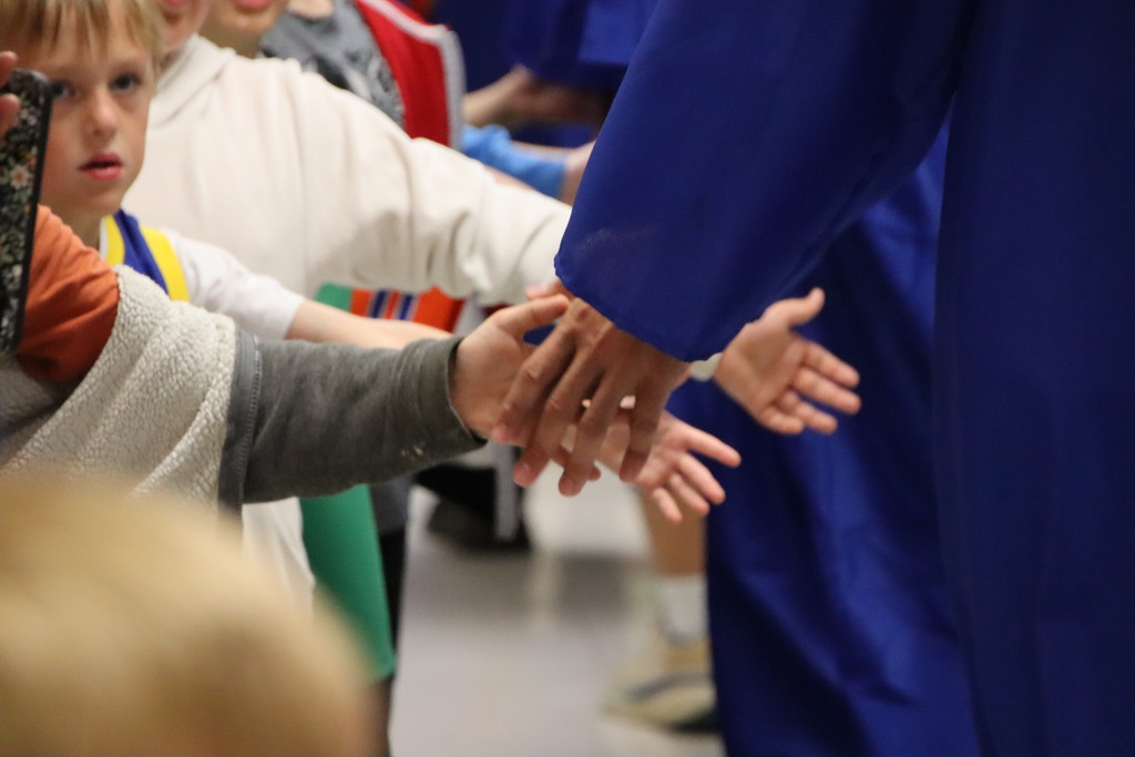 Two students high fiving