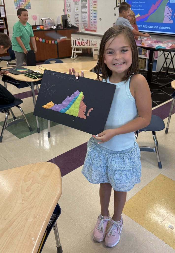Student with a salt dough map of VA