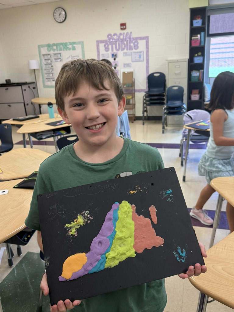 Student with a salt dough map of VA
