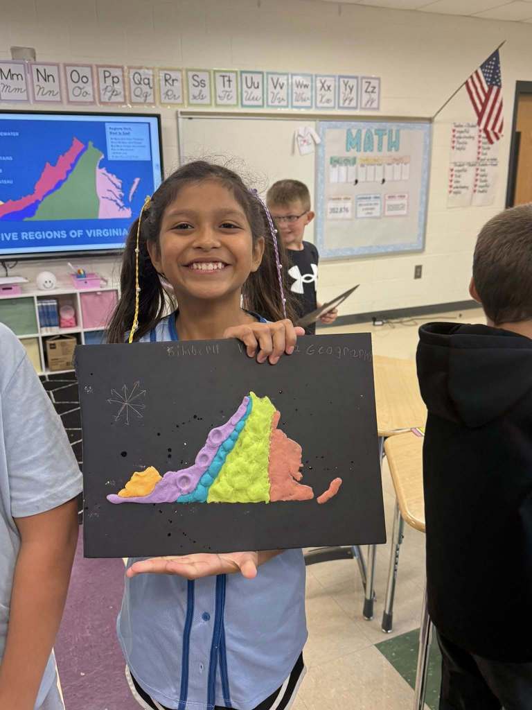 Student with a salt dough map of VA
