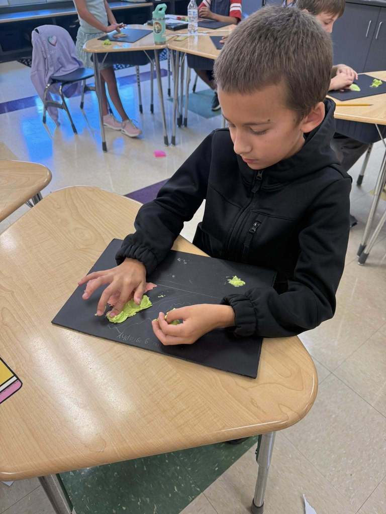 Student with a salt dough map of VA