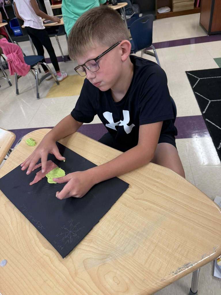 Student with a salt dough map of VA