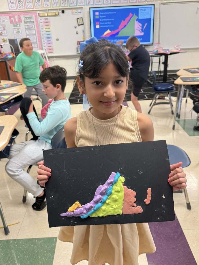 Student with a salt dough map of VA