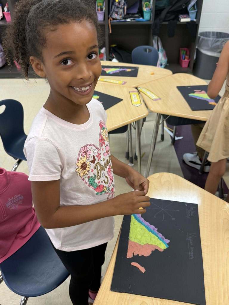 Student with a salt dough map of VA