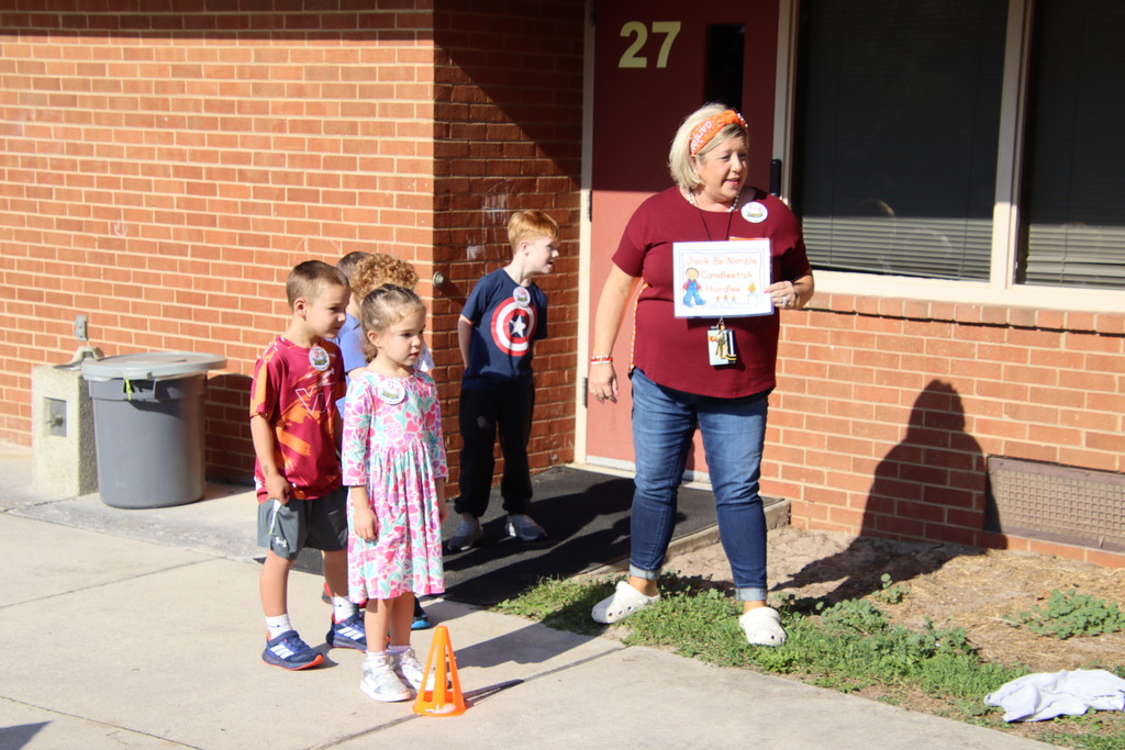Students standing in line with the teacher 