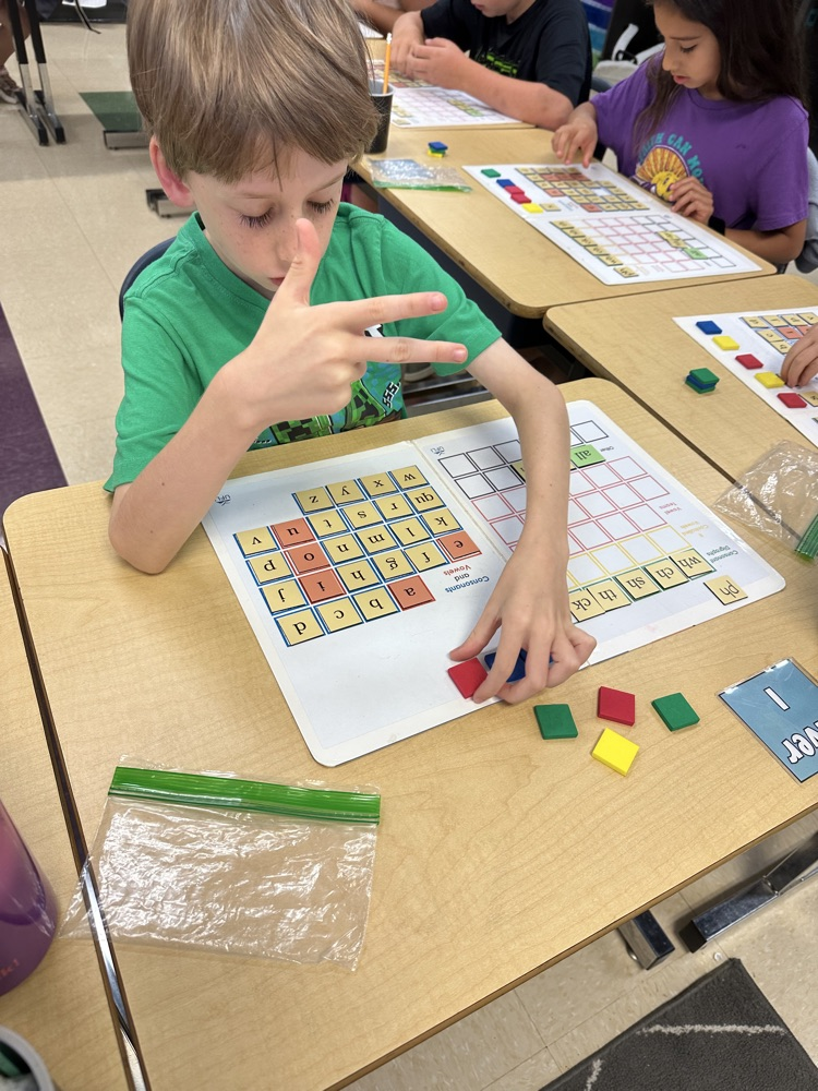 student with reading manipulatives 