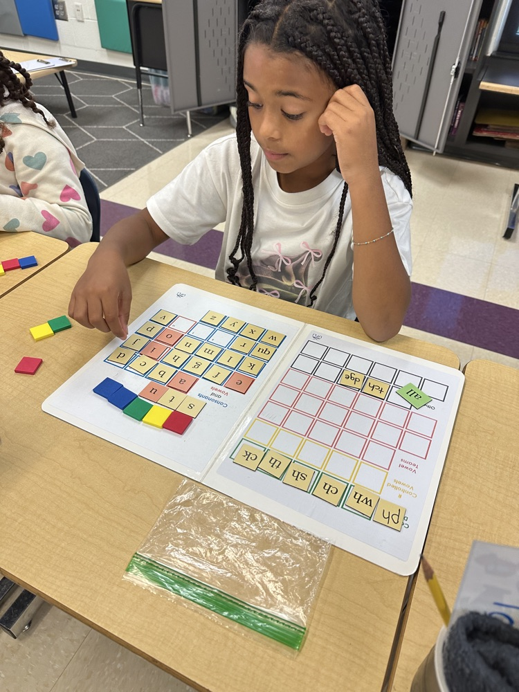 student with reading manipulatives 