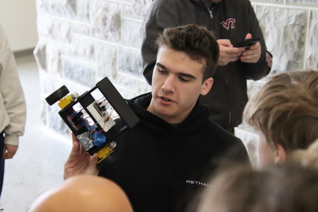 VT student presenting to a group of AES students