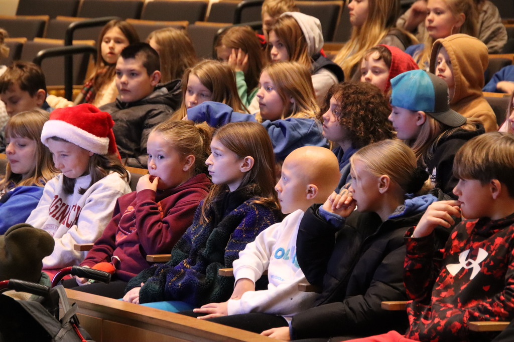 Group of AES students sitting in an auditorium