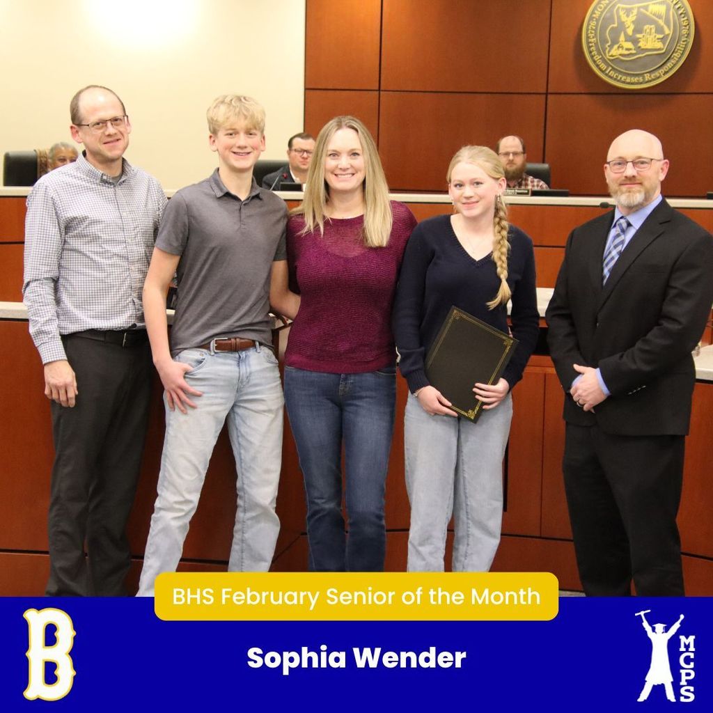 Sophie Wender standing with family