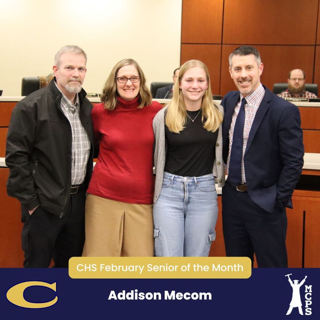 Addison Mecom standing with family