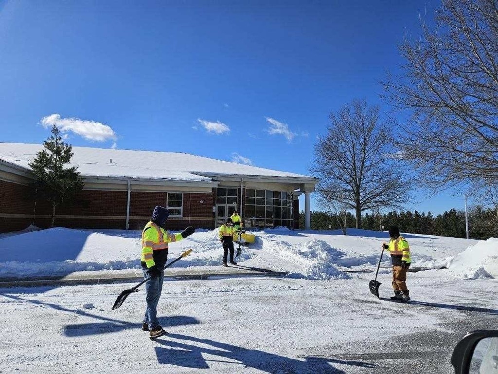 MCPS facilities staff shoveling snow