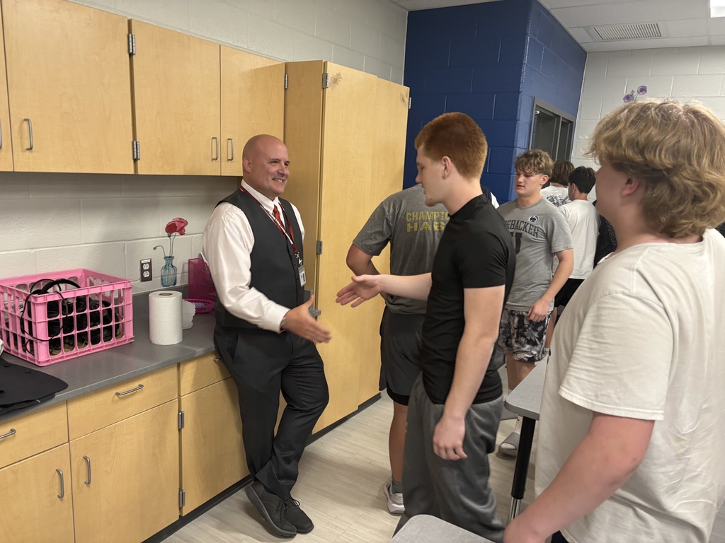 CHS football player shaking Dr. Guempel's hand