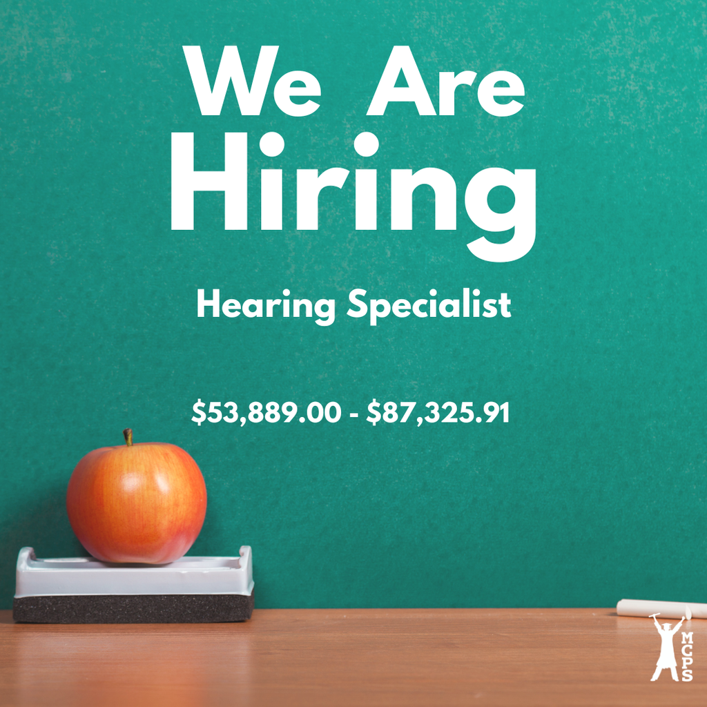 A square graphic with a textured green chalkboard background. Large, bold white text reads "We Are Hiring," followed by "Hearing Specialist" and a salary range of "$53,889.00 - $87,325.91." On a wooden ledge at the bottom left sits a red and orange apple resting on a chalkboard eraser. A small piece of white chalk sits on the bottom right. In the bottom right corner is a white logo featuring a silhouette of a person in a graduation cap with the vertical text "MCPS."