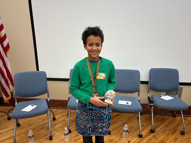 Sett standing with a trophy