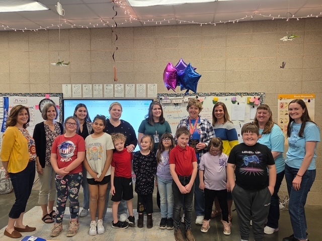 Ms. Masek receives her Wildcat award at JBE.