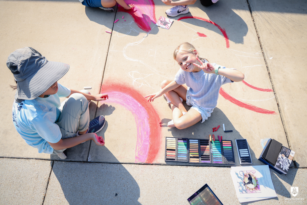 child playing with chalk