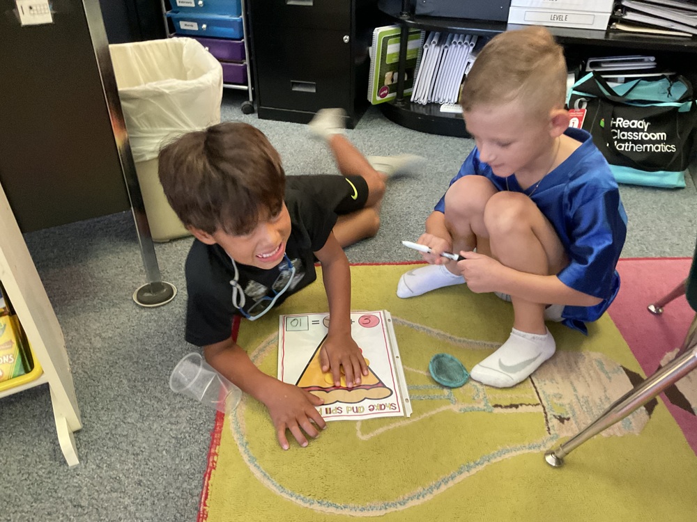 boys sitting on floor