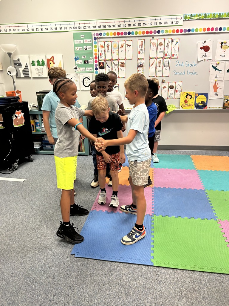 students playing games and looking at hedge hog