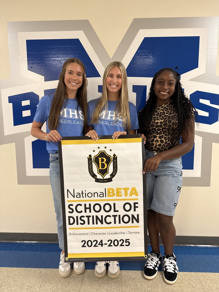 Students holding banner with recognition