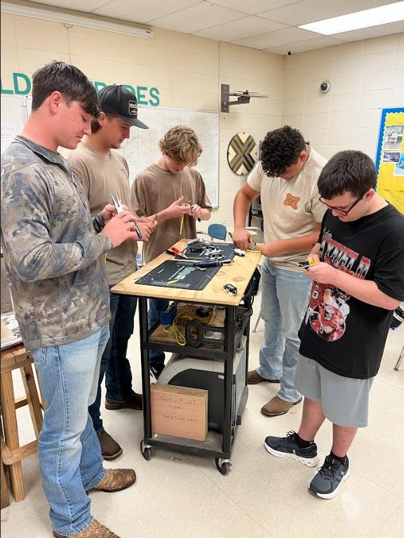 students standing at table