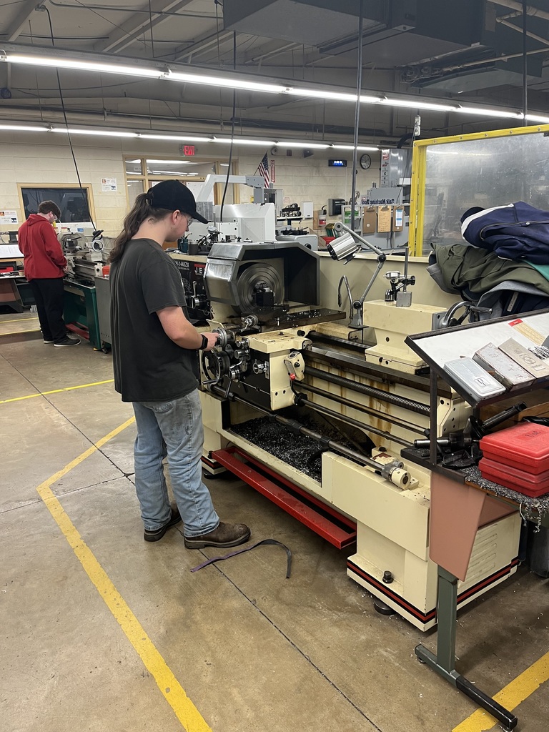 student standing at a machine