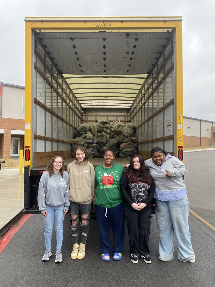 students with shoes in truck
