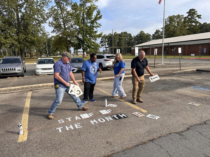 people standing in parking lot