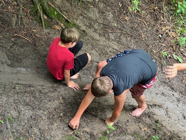 Students Climbing Muddy Hill