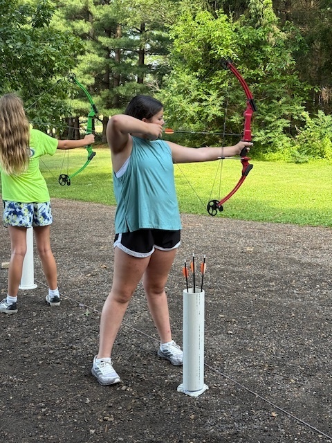 Students Shooting Arrows