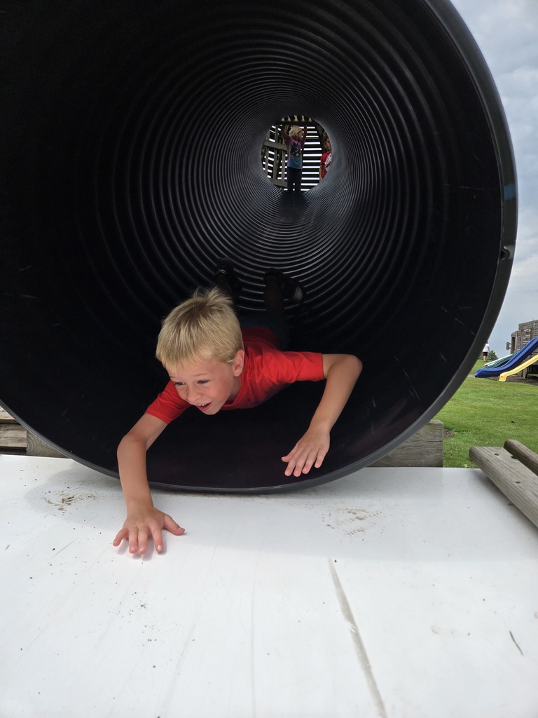 Student Going Down Slide