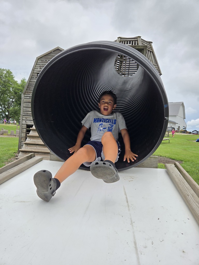 Student Going Down Slide