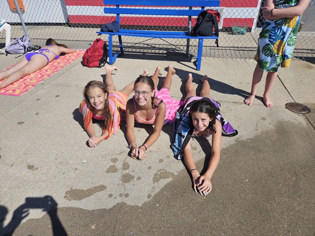 students warming up with towels