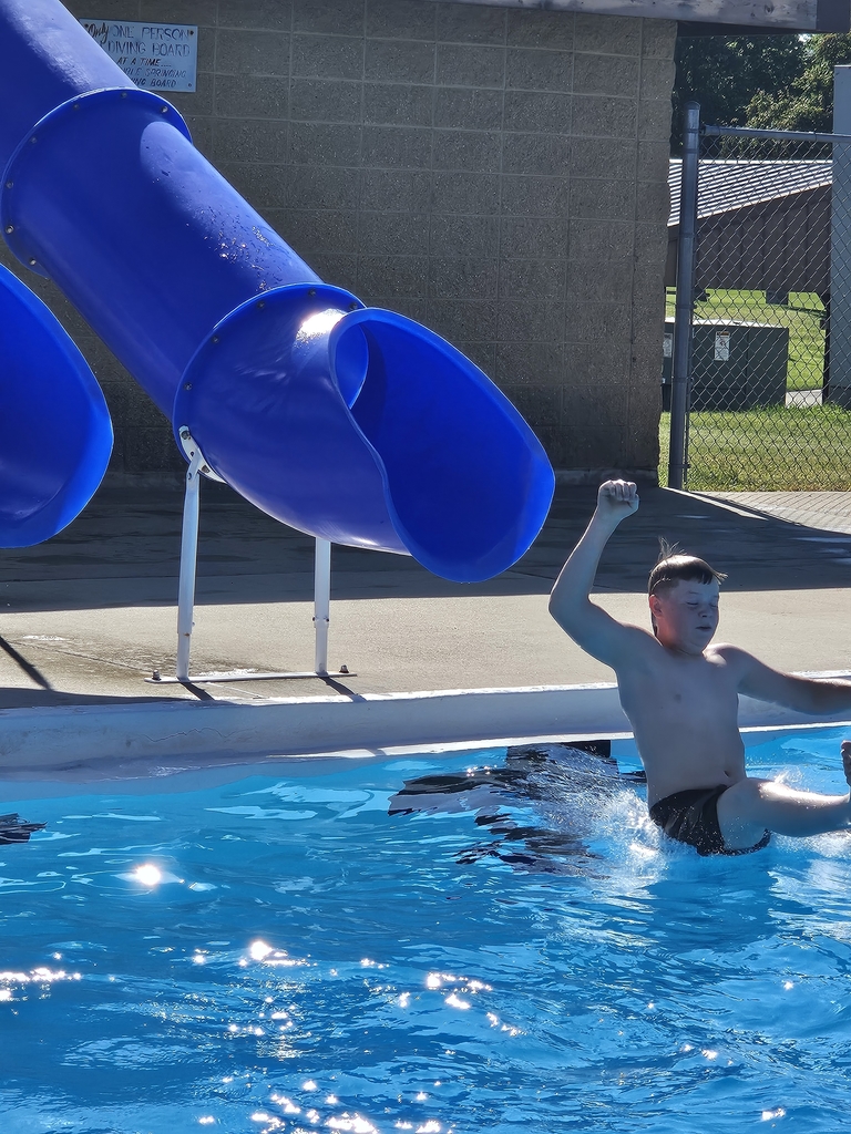 student going down slide