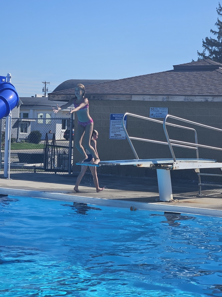 student jumping off diving board