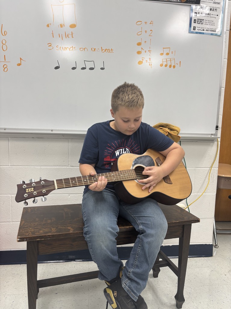 Student Playing Guitar