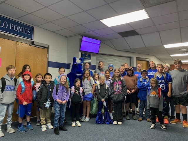 Lady Cross Country Athletes with Elementary Students