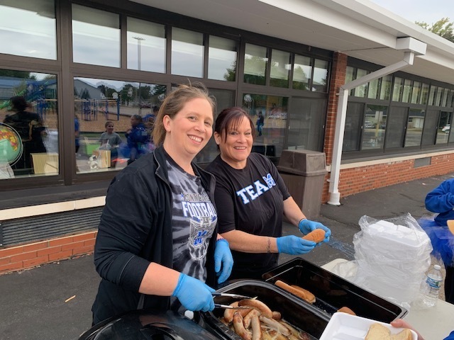 Food Service Team Serving Brats
