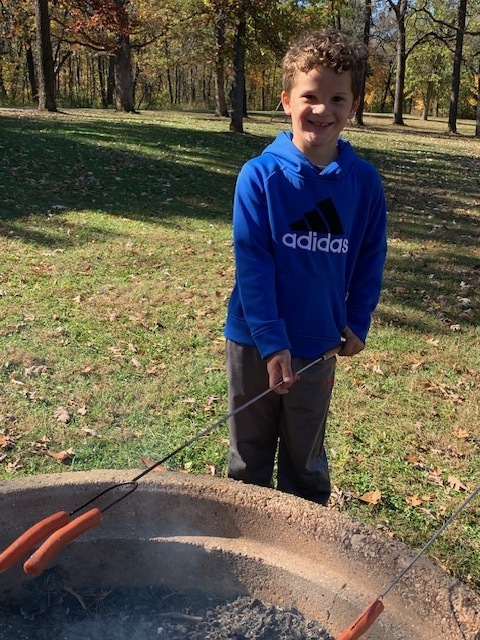 First Grader Grilling Hot Dogs