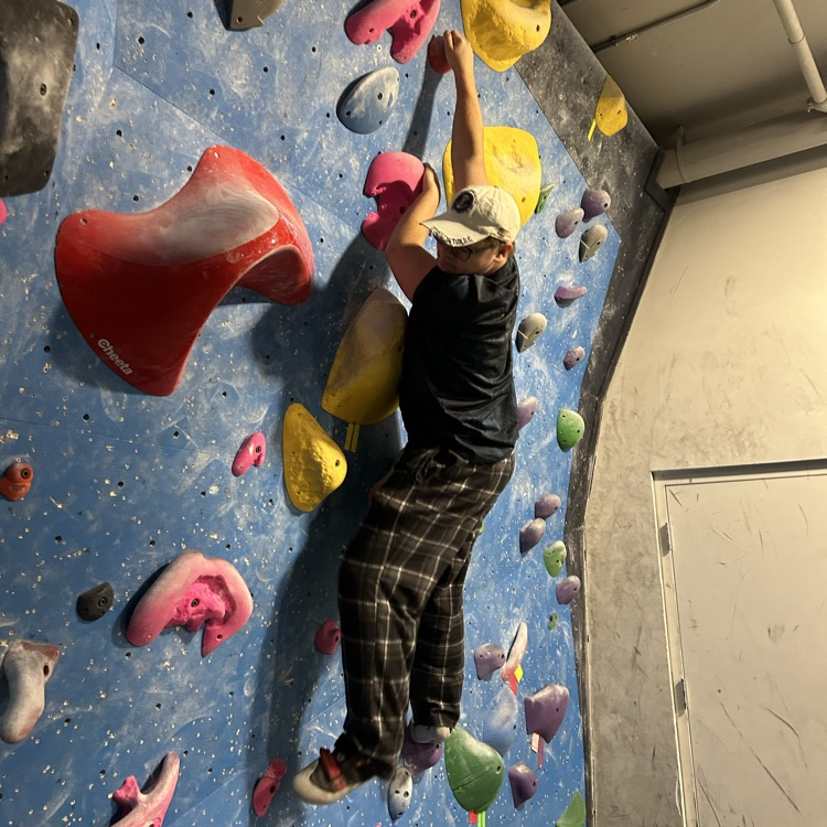 Student on Rock Climbing Wall