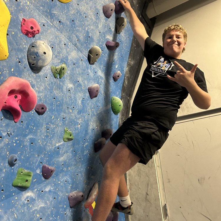 Student on Rock Climbing Wall