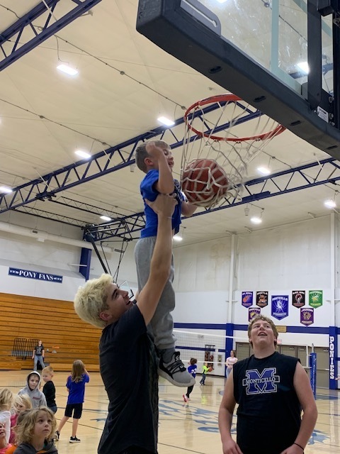 Student Shooting Basket at Play with the Ponies