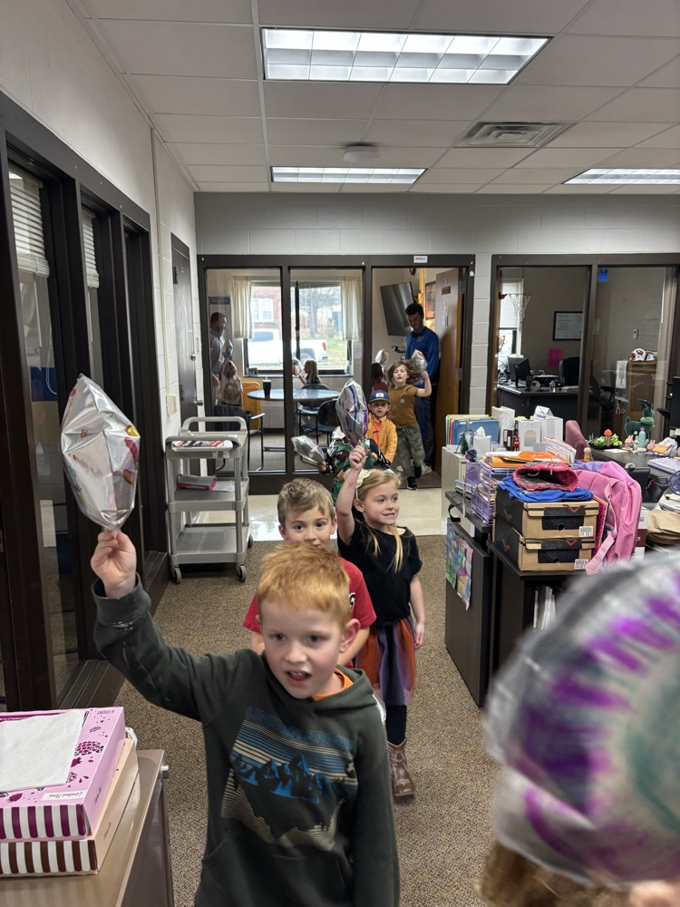 kids holding balloons
