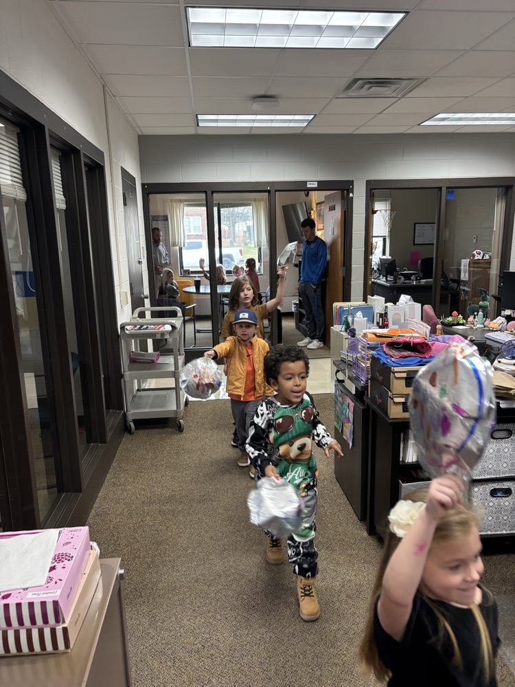 kids holding balloons
