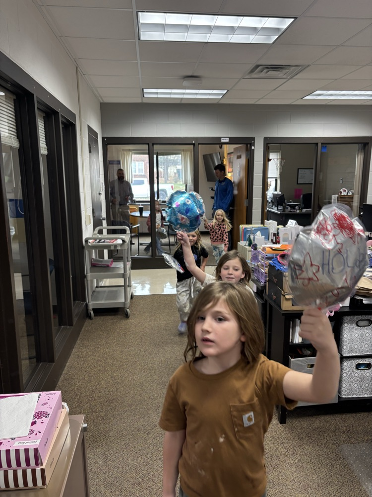 kids parading balloons