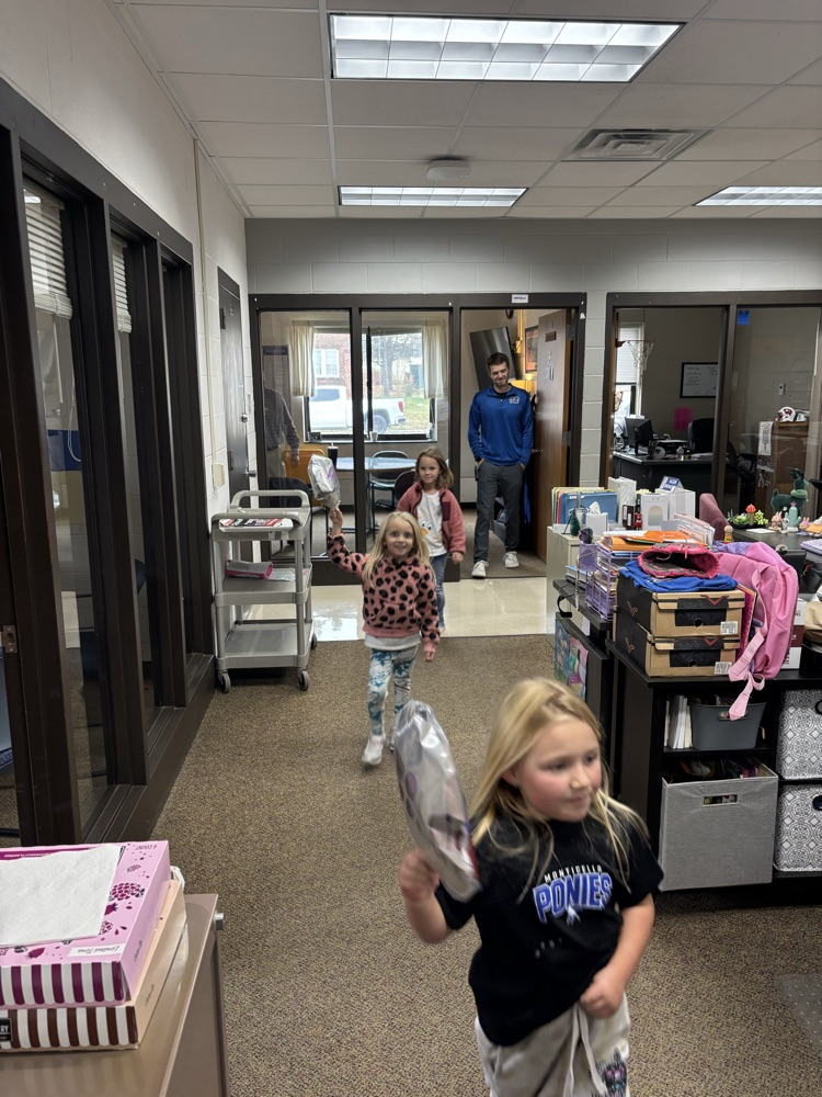 kids parading balloons