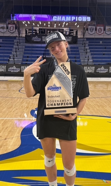 St. Thomas Volleyball Player with Trophy