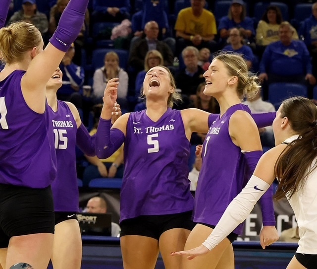 St. Thomas Volleyball Players Celebrating