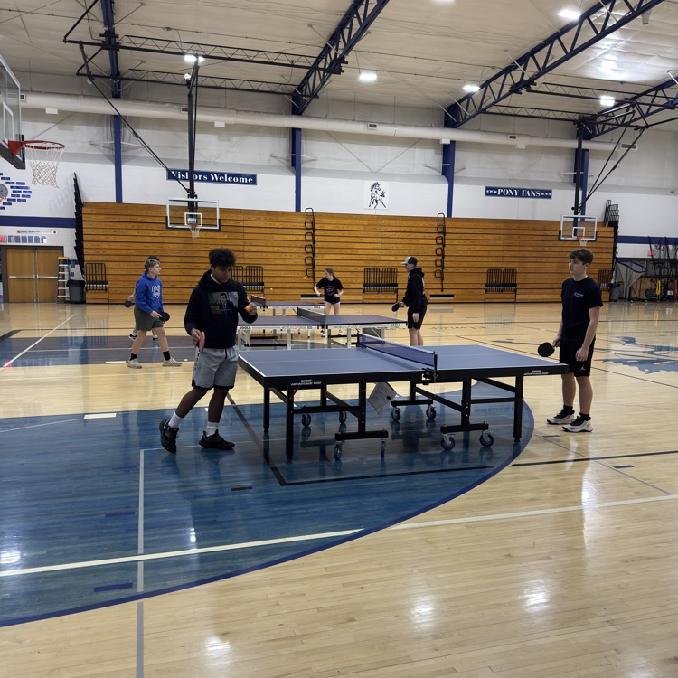 Students playing table tennis