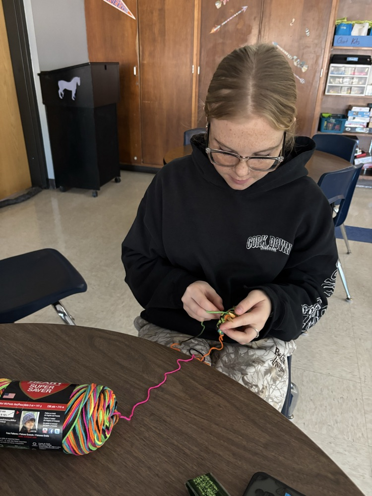 student knitting